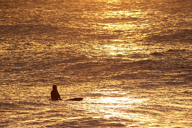 Surfing the North Shore at Sunset